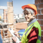 Senior woman working on a construction site